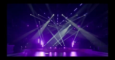 Stage beam lights in tv set studio colours Stock Footage 274386988