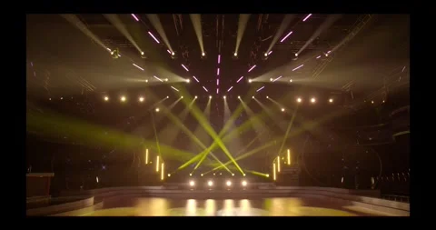 Stage beam lights in tv set studio colours Stock Footage 274386991