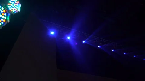 The stage with colorful spotlights. Lights are turned on from darkness. Stock-Footage 160649953