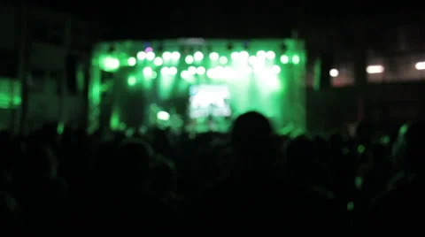 Stage at a concert in the dark. The crowd in front of the stage. green light Stock Footage 41357436