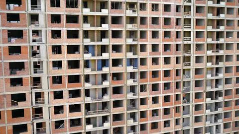 Stage of construction of a multi-storey building. Unfinished multi-storey bui Stock Photos