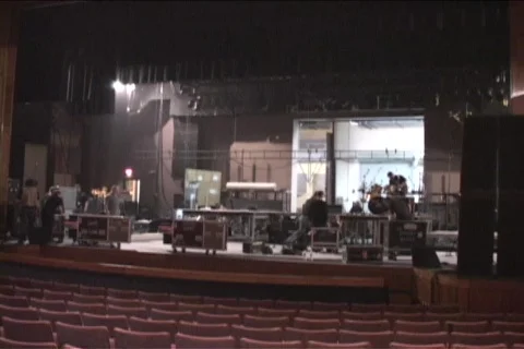 A stage crew tears down props and lighting equipment. Stock Footage 552466