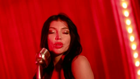 The stage is decorated in bright red tones, creating an atmosphere of luxury and Stock Footage 289440709
