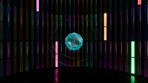 On stage, a flashing neon sphere surrounded by neon multi-colored VJ Loop lights Stock Footage 271151039