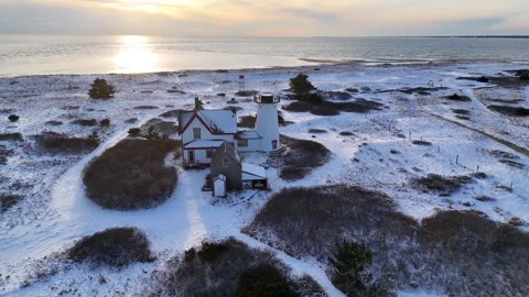 Stage Harbor Lighthouse Aerial in Winter with Snow at Chatham, Cape Cod Stock Footage 325630734