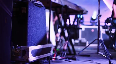 Stage with instruments and people setting up before a concert Stock Footage 47855076