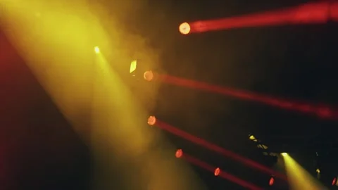 Stage led spotlight shining through haze creating dramatic and atmospheric am Stock Footage 296844884