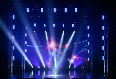 Stage light with colored spotlights and smoke Stock Photos