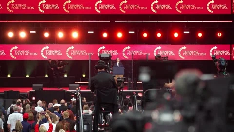 Stage lighting above the crowd at the Charlie Kirk memorial service Stock Footage 345298272