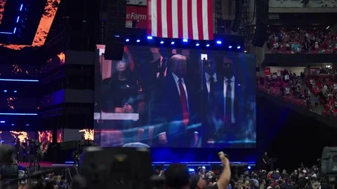 Stage lighting and the video wall during the Charlie Kirk memorial service Stock Footage 345298381