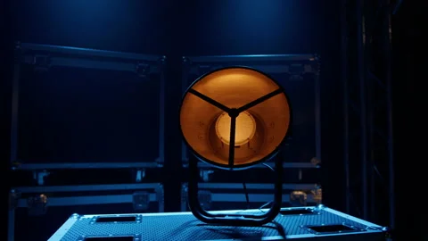 Stage lighting device on the background of boxes with concert equipment Stock Footage 194439942