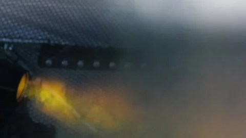 Stage lighting fixture in the form of a row of bulbs flickers in the fog in a 스톡 동영상 155211367