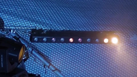 Stage lighting fixture in the form of a row of bulbs flickers in the fog Video stock 155211453
