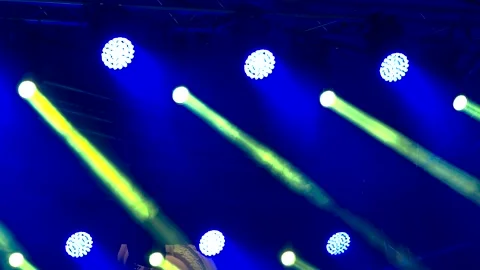 Stage Lighting with Powerful Spotlights and Light Beams in Concert Venue Stock Footage 347578631