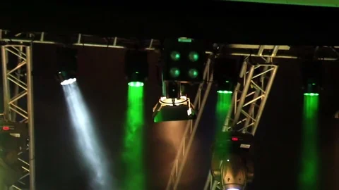 Stage lightning at night shot in slow-motion. Lights shining through fog. Stock Footage 81423995