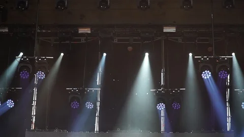 Stage lights are turned on during the concert blinking and shining. Stock Footage 99496788