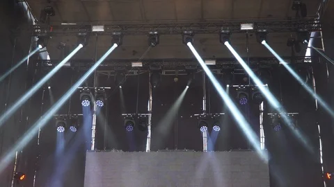 Stage lights are turned on during the concert blinking and shining Stock Footage 99496865