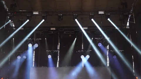 Stage lights are turned on during the concert blinking and shining Stock Footage 99496888