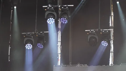 Stage lights are turned on during the concert blinking and shining Stock Footage 99496911