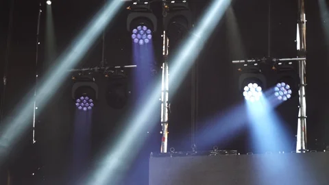 Stage lights are turned on during the concert blinking and shining Stock Footage 99496937