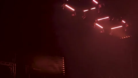 Stage lights glowing in a dark concert venue Stock Footage 337800472
