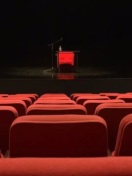 Stage with microphone and table seen from audience seats. Anticipation, art,  Stock Photos