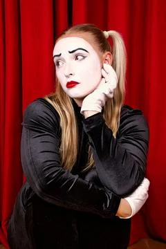 On stage is a pantomime artist with a dramatic expression on his face Stock Photos