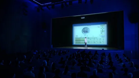 On Stage: Scientific Startup CEO Shows  Healing 3D Brain Concept on Big Screen Stock Footage 126502253
