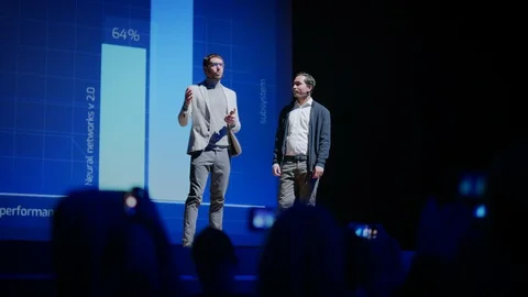 On Stage: Startup CEO, Tech Engineer Present New Product. Speakers Lead Lecture Stock Footage 122813936