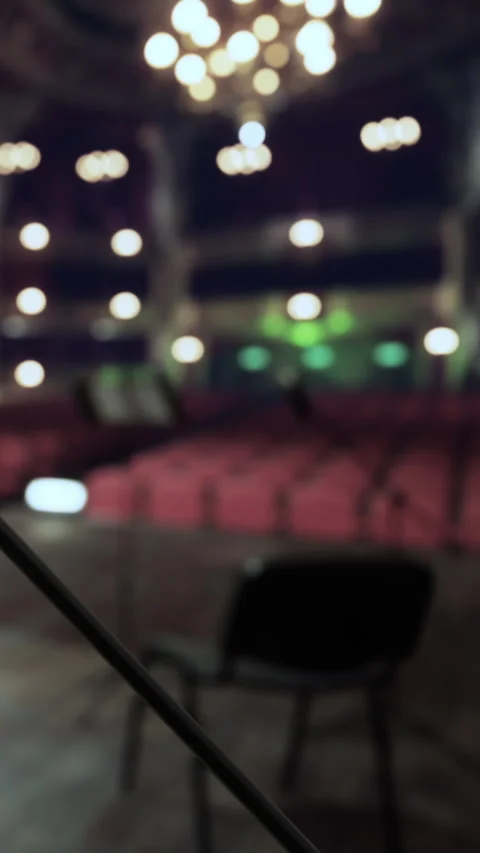 Stage view at a theater with empty seats and soft lights in evening Stock Footage 339504798