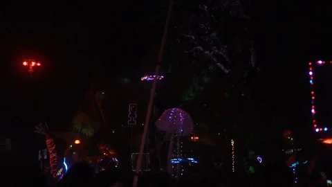 Stage with visual neon effects and dj playing music at electronic music festival Stock Footage 122377052
