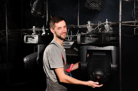 The stage worker sets up the lights Stock Photos