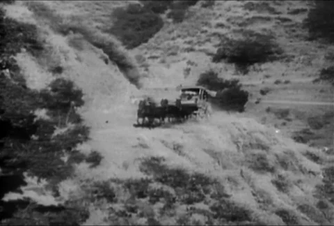 Stagecoach falling off cliff on a mountain road, 1930s Видео 95348173