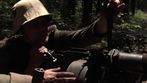 Staged Recreation of WW1 German Machine Gunner Loading to fire in 1918 動画素材 185209687