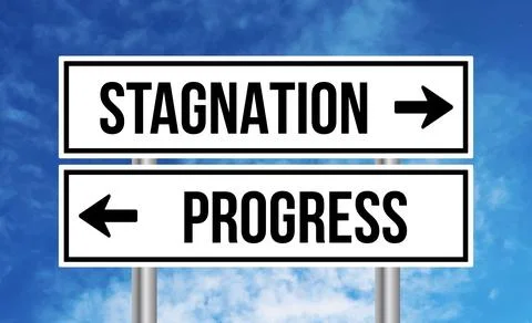 Stagnation or progress road sign on blue sky background Stock Photos