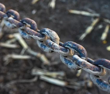 Stained chain on dark background Stock Photos