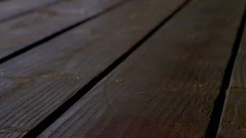 Stained deck boards, close up left to right smooth pan. Stock Footage 108895416