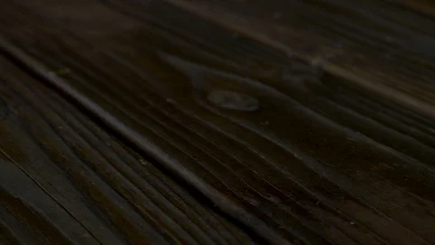Stained deck boards close up, right to left pan Stock Footage 108895339