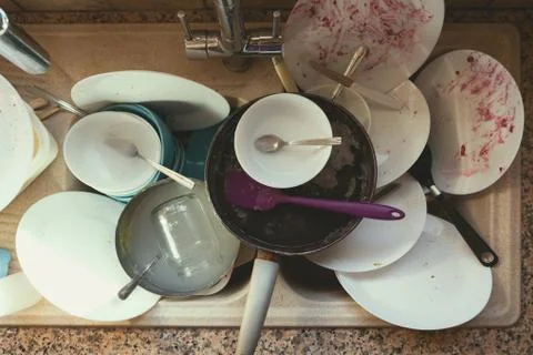 Stained Dirty Dishes In Kitchen Sink Stock Photos