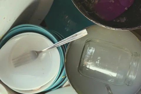 Stained Dirty Dishes In Kitchen Sink Foto stock