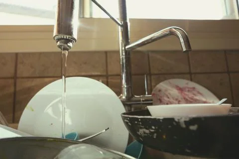 Stained Dirty Dishes In Kitchen Sink Stock Photos