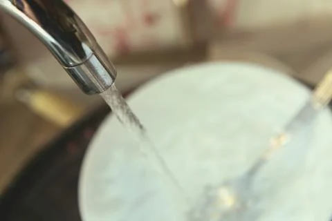 Stained Dirty Dishes In Kitchen Sink Foto stock