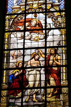 Stained glass church window of Christs baptism,Brussels, Belgium Stock Photos