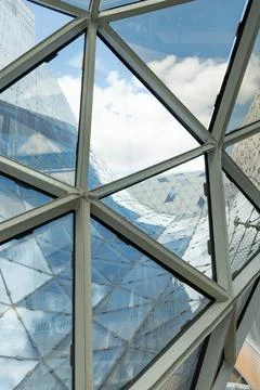 Stained glass in the form of honeycombs in a modern building. Stock Photos