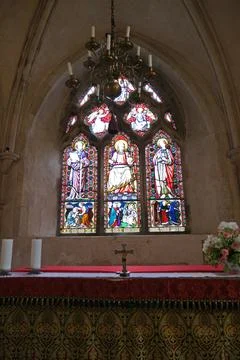 Stained Glass Triptych and Altar in Historic English Priory Church Stock Photos