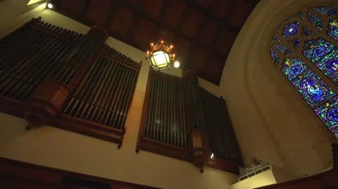 Stained glass window and pipe organ dark (untrimmed) Stock Footage 10712860