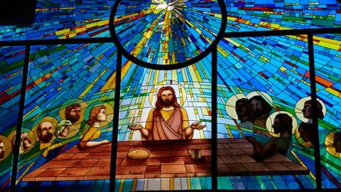 Stained glass window depicting Jesus and the twelve Stock Photos