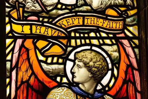 Stained glass window featuring scripture and knights, European design in Stock Photos
