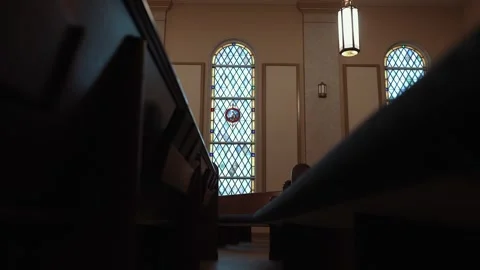 Stained Glass Window Illuminating the Interior of a Historic Church Stock-Footage 343281121