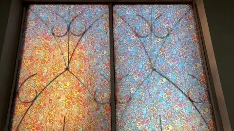 Stained glass window with openwork lattice and sunlight. Close-up. Spiritual wor Stock Footage 301076107